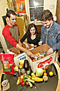 Yellow door volunteers pack a food hamper