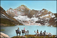 Early photograph of men on horseback in the Rockies